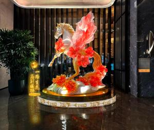 a statue of a phoenix on top of a table at Oriental Riverside Bund View Hotel (Shanghai International Convention Center) in Shanghai