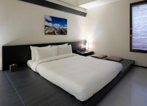 a large white bed in a room with a window at Sotetsu Hotels The Splaisir Seoul Myeongdong in Seoul