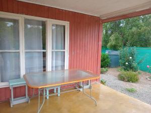 a table sitting on the porch of a house at Don José in Los Molles