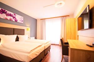 TV a/nebo společenská místnost v ubytování BlnCty Hotel + 37 fotografií