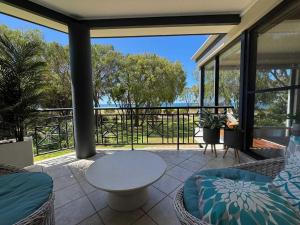 a living room with a view of the ocean at 5@CapeView, beachfront Geographe Bay in Busselton