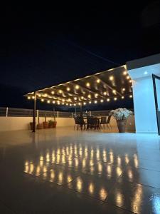 a group of lights on a patio at night at Casa Cerritos in Comitán