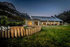 a house with a fence in front of it at Agritur La Dolce Mela - Adults Only in Vezzano