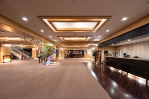 a large lobby with a bar in a building at Hotel Kanronomori in Niseko +62 photos
