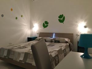 Łóżko lub łóżka w pokoju w obiekcie Casa Comasia