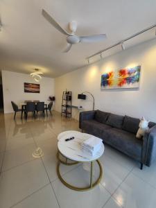 a living room with a couch and a table at Manhattan Condominium Ipoh in Ipoh