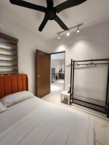 a bedroom with a bed and a ceiling fan at Manhattan Condominium Ipoh in Ipoh +197 photos