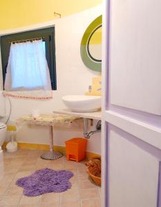 a bathroom with a sink and a mirror at I Silos Guest house in Seriate