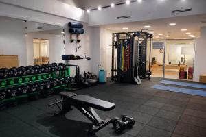 a gym with lots of equipment in a room at Olen Uskudar Hotel in Istanbul