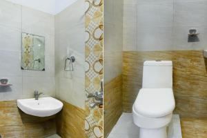 a bathroom with a toilet and a sink at Townhouse Oak Gravity Inn in Pune +42 photos