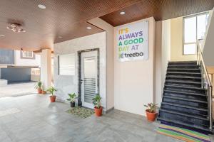 a building with a sign that reads its always a good day atrax at Treebo Himalayan Homestay in Pune +41 photos