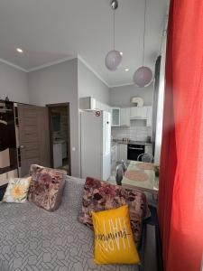 a living room with a couch and a kitchen at Центр.Леся Українка in Lutsk