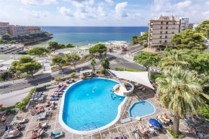 an overhead view of a swimming pool with the ocean in the background at 4R Salou Park Resort I in Salou