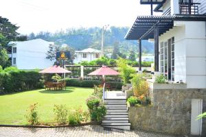Vrt pred nastanitvijo Unique Cottages