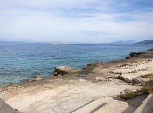 an island in the middle of a large body of water at Apartments Sea Line in Prigradica