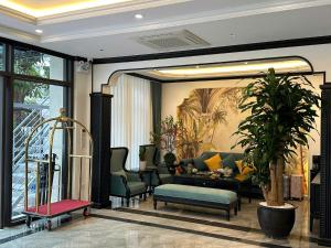 a living room with a couch and a table at Royal Hotel Lâm Hạ in Hanoi