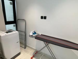 a treadmill in a room with a car on a wall at شقة ياسمين الفندقية in Medina +13 photos