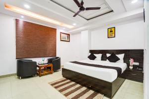 a bedroom with a large bed and a window at Yashobhoomi Grand in Jāmb