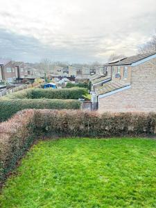 a view of a yard with a brick house at Cosy one bed Flat in Stevenage in Stevenage