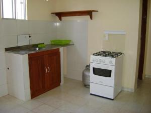 Ett kök eller pentry på Residencial Dom Luiz