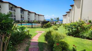 a courtyard of a building with a garden at Topanga 31 in Margate