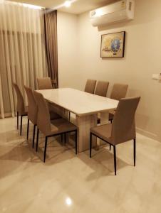 a dining room with a table and chairs at Pool villa Cream Darin in Ban Hua Phrong