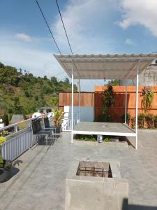 a patio with a table and a white canopy at Sangkuriang 1 - Private Dome in Bandung