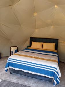 a bedroom with a bed in a tent at Sangkuriang 1 - Private Dome in Bandung