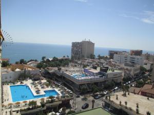 an aerial view of a city with a pool at La Nogalera 7 in Torremolinos