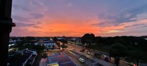 a view of a city at sunset at Extreme Boutique Hotel in Kluang