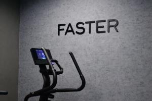 a cell phone on a stand in front of a faster sign at B1 Downtown Hotel, Sofia in Sofia +23 photos