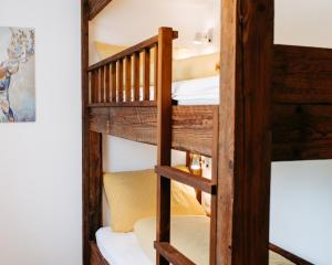 a bunk bed room with two bunk beds at Ferienhof Leopold in der Grub in Ort