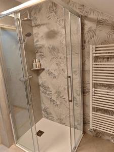 a shower with a glass door in a bathroom at Apartma 198 in Kranjska Gora +16 photos
