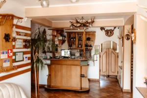 a kitchen with a bar in a room at Pensiunea Maria in Agapia