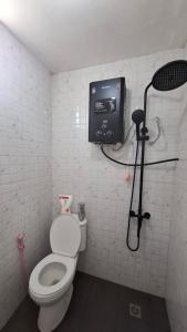 a bathroom with a toilet and a shower in it at Sangkuriang 2 - Private Dome in Bandung