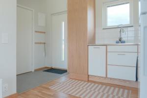 a kitchen with a counter and a sink and a window at Gullbrannagården in Halmstad +40 photos
