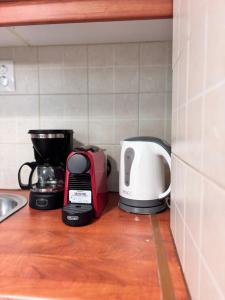 a kitchen counter with two toasters and a toaster at Relax - Patras Apartment in Patra