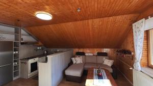 a small living room with a couch and a table at Apartmán Otília in Ždiar