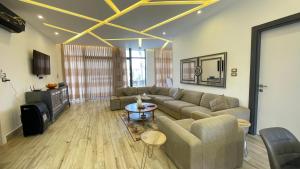 a living room with a couch and a table at Villa W2 in Amman