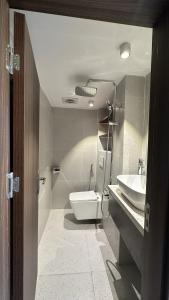 a bathroom with a toilet and a sink at Smile Home in Hanoi +17 photos