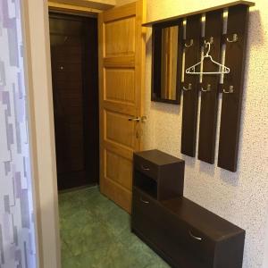 a room with a closet with hockey equipment on the wall at Teatra 34 in Daugavpils