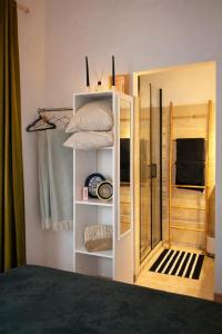 a room with a door open to a bedroom at Un Chalet au Verger-Dog friendly-Jacuzzi & Massages in Conteville