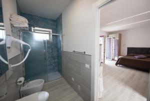 a bathroom with a shower and a toilet in a room at Cala Azzurra in Marciana +18 photos