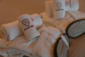 a group of towels sitting on top of a table at Chalet Noèr in Ledro