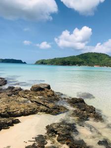 a view of a beach with rocks in the water at Sea La Vie Cottage in El Nido