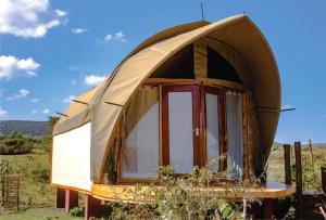 a dome tent in the middle of a field at Hotel White Sandcastle Mara Lodge in Sekenani
