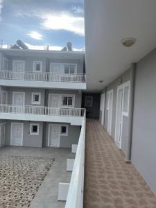 an empty hallway of a building with white units at Barbie II in Ialysos