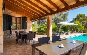 a patio with a table and chairs and a pool at Moscari in Moscari +34 photos