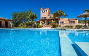a large swimming pool in front of a house at Can Palleta Nou in S'Horta +49 photos
