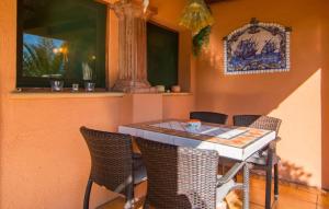 a table and chairs sitting in a patio at Silencio in Cala Ratjada